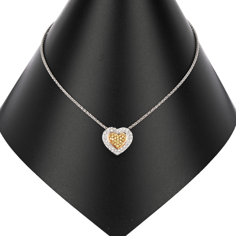 Collier mit Herz-Anhänger, 45 Brillanten ca. 0,70 ct, 24 gelbe Brillanten (beh.) ca. 0,24 ct, BiC750 ca. 12,6 g, Länge: 43,5 cm
