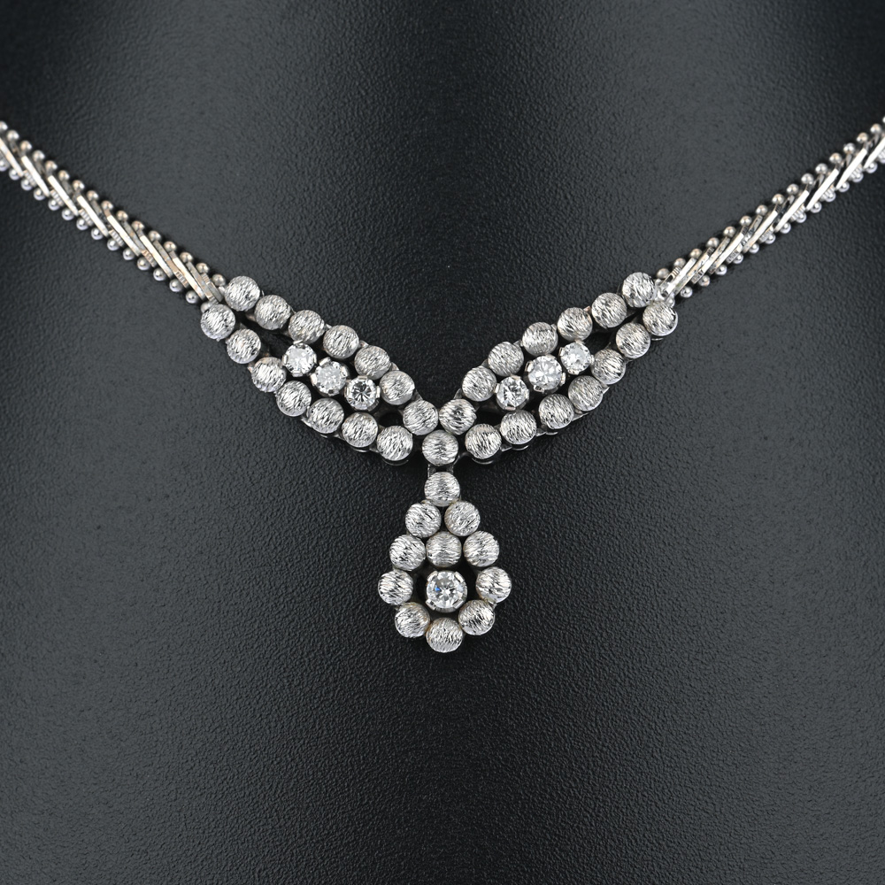 Collier, 7 Brillanten 0,50 ct, WG585 ca. 31,9 g, Länge ca. 44 cm