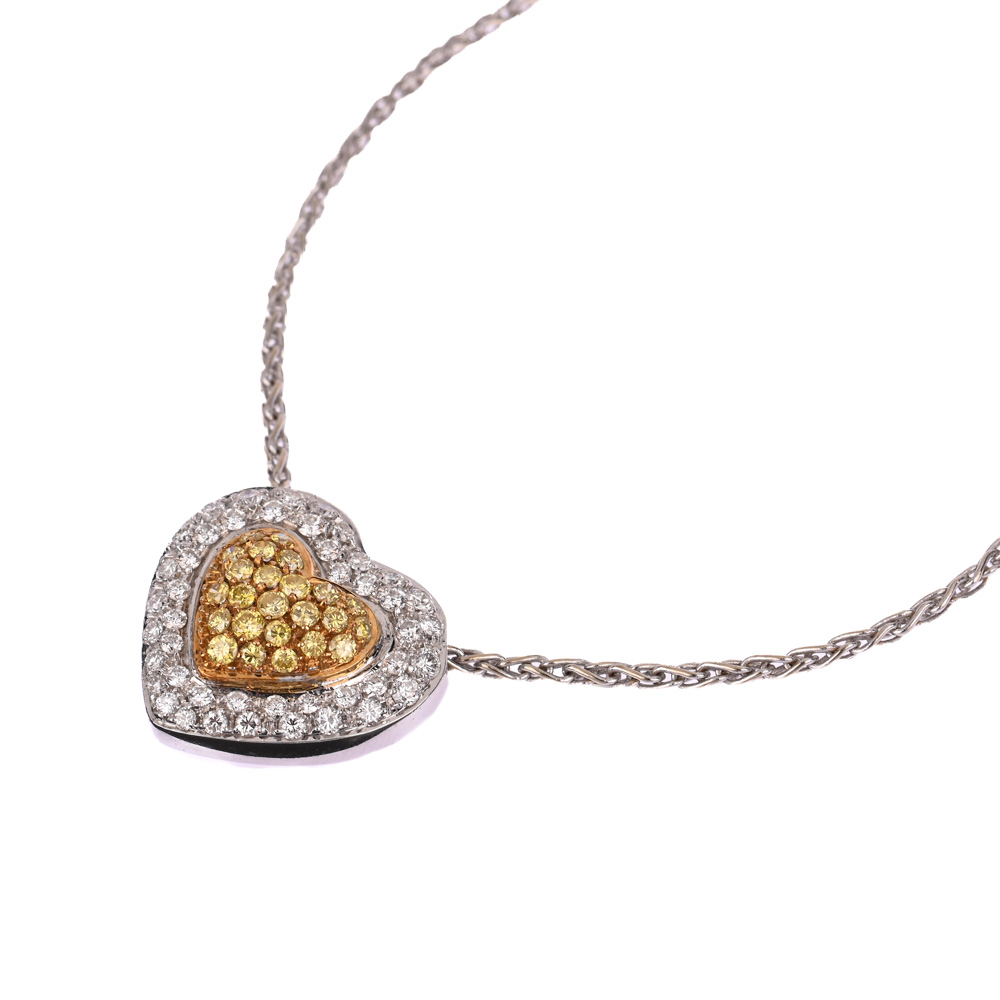 Collier mit Herz-Anhänger, 45 Brillanten ca. 0,70 ct, 24 gelbe Brillanten (beh.) ca. 0,24 ct, BiC750 ca. 12,6 g, Länge: 43,5 cm